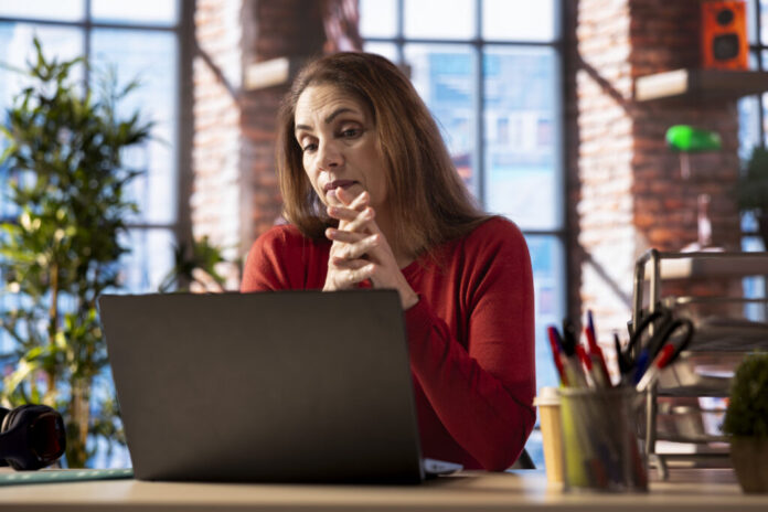 Adult joining online lesson to work on new skills from home office